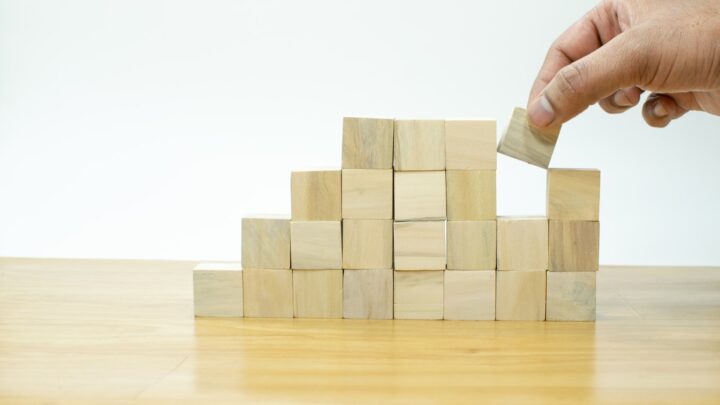 Wooden building blocks stacked on a table