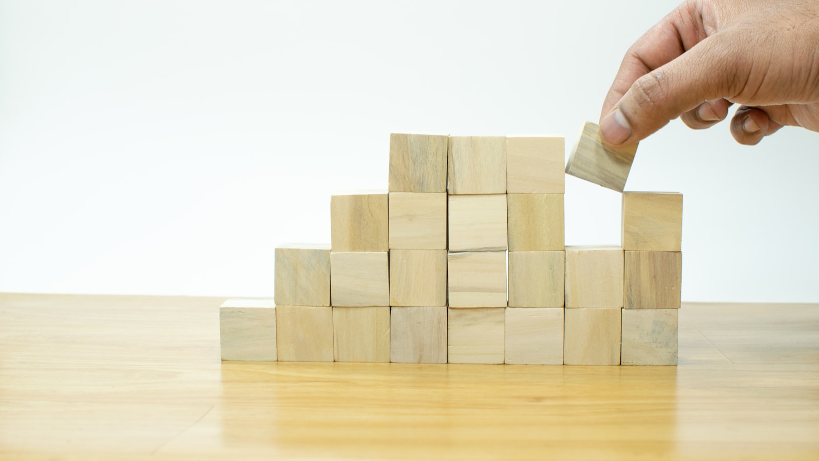 Wooden building blocks stacked on a table