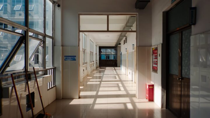 A quiet hospital corridor lit by natural light