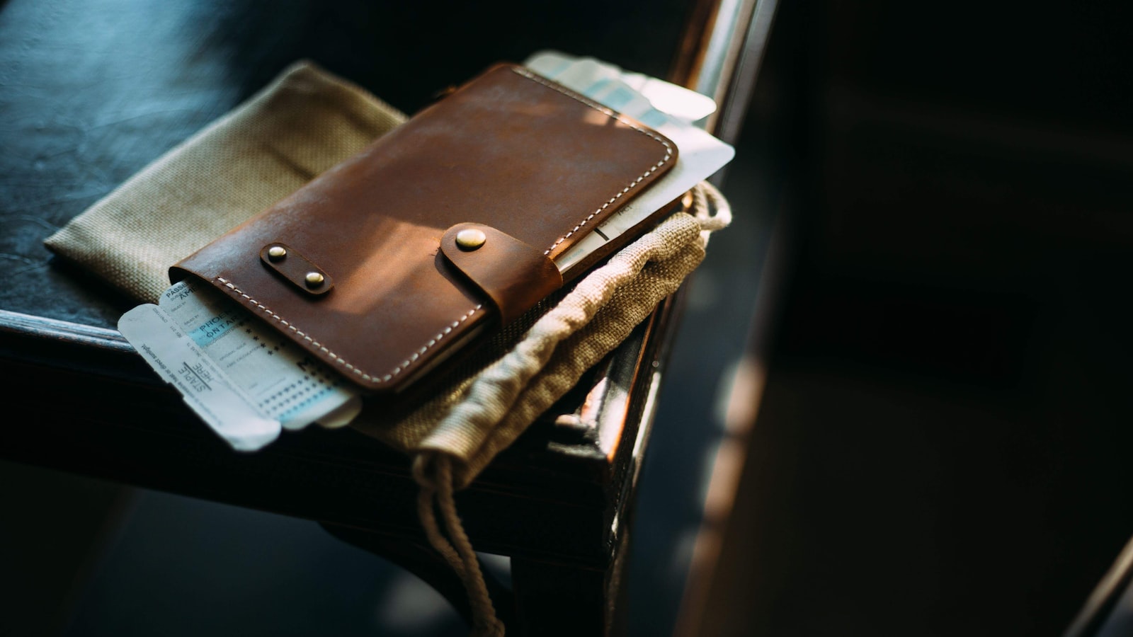 An open empty wallet resting on a plain table