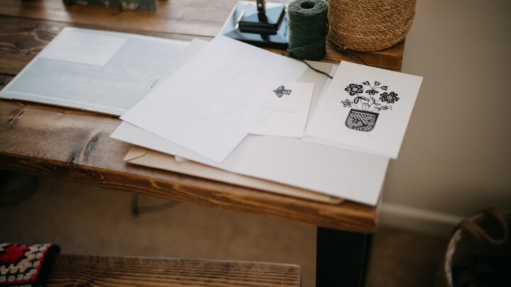 Two closed folders placed side by side on a desk