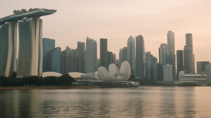 The Singapore skyline seen across water at dusk