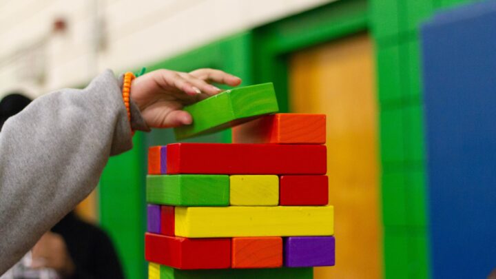 Wooden sensory play blocks arranged on a table in a therapy room