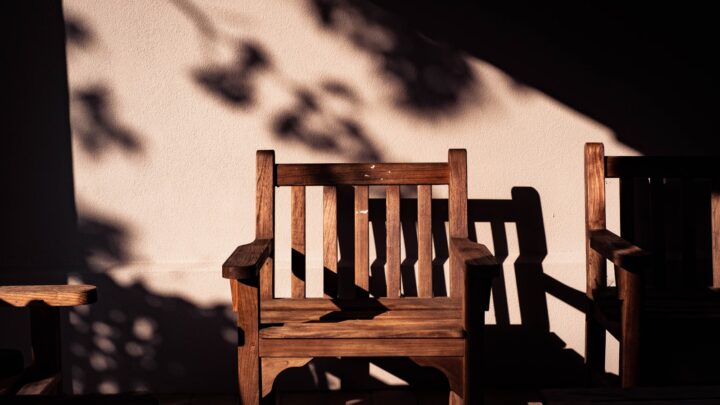 An empty chair by a window, representing an absent or uncooperative spouse in a Singapore divorce