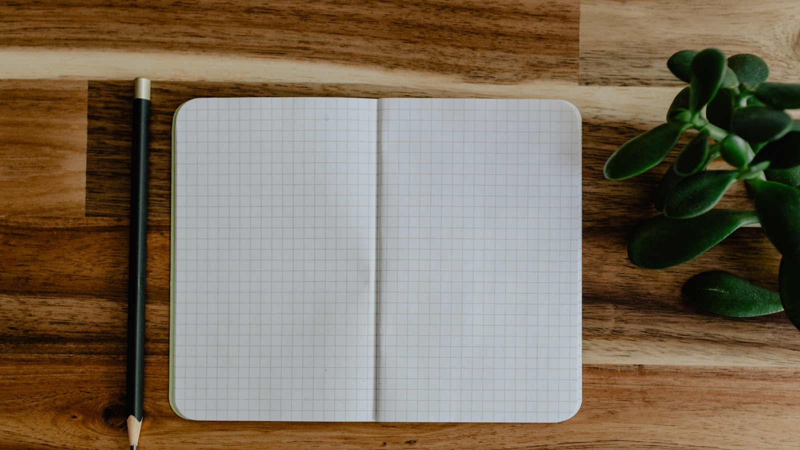 A printed checklist and pen on a wooden table