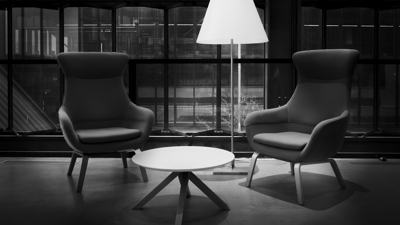 Two wooden chairs positioned opposite each other in an empty room