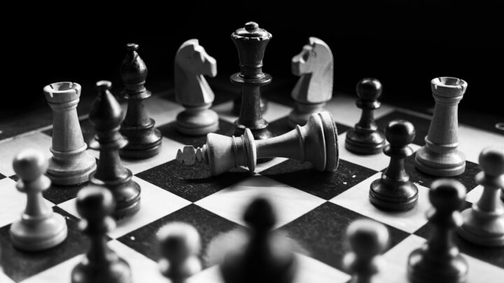 A chess board mid-game, representing the strategy question of filing for divorce first in Singapore