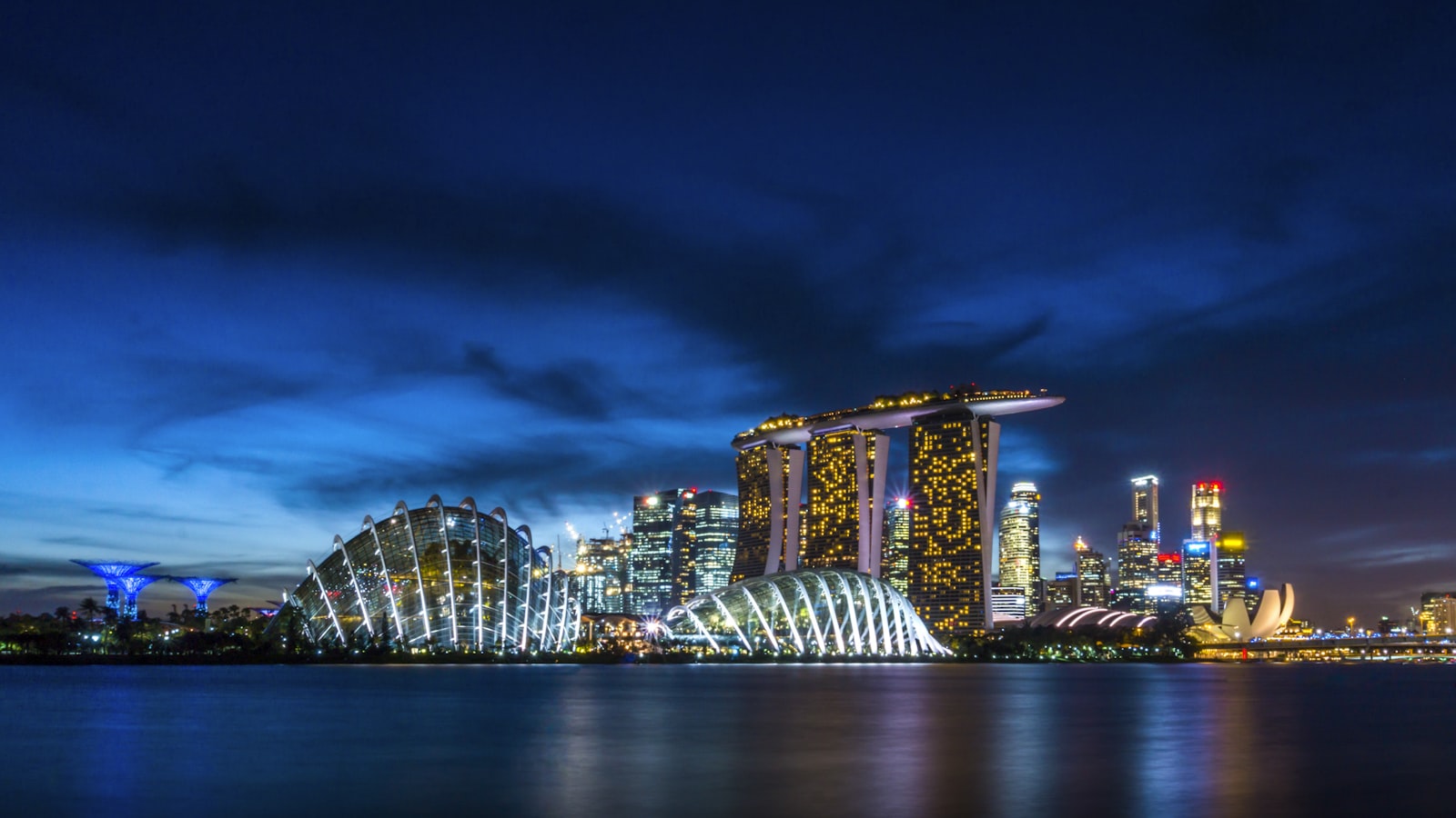 The Singapore skyline at dusk seen from the waterfront