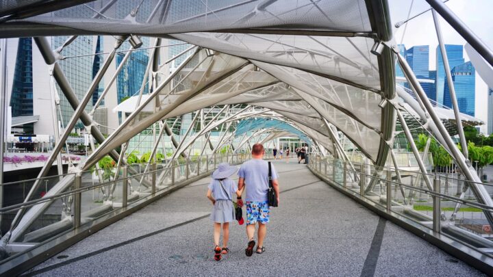 A grandparent and child walking together in a park