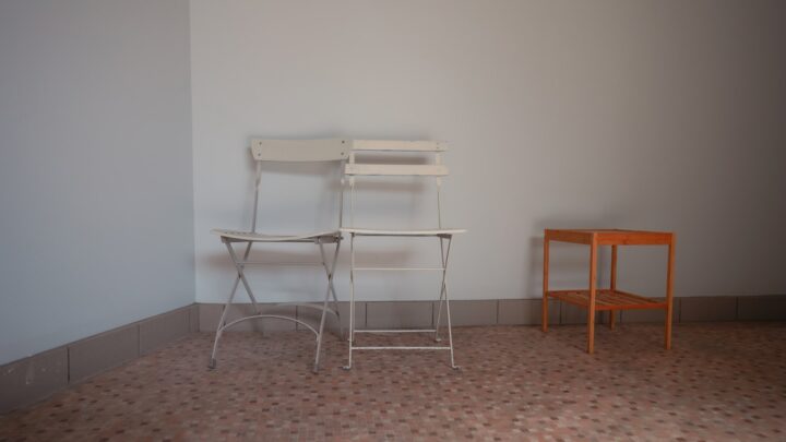 Two separate chairs representing spouses living apart under a judicial separation in Singapore