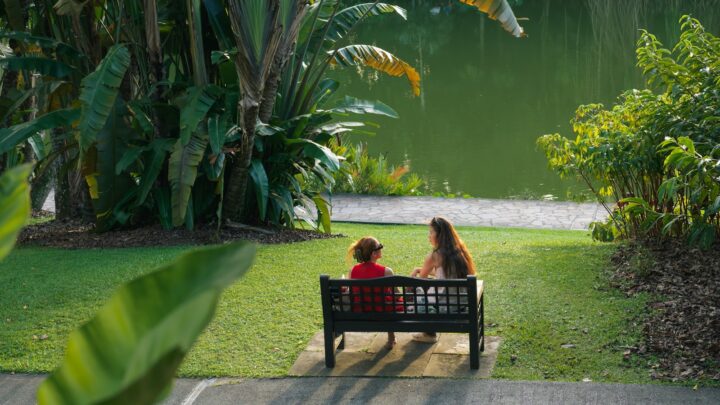 Parent walking with a young child in a Singapore park