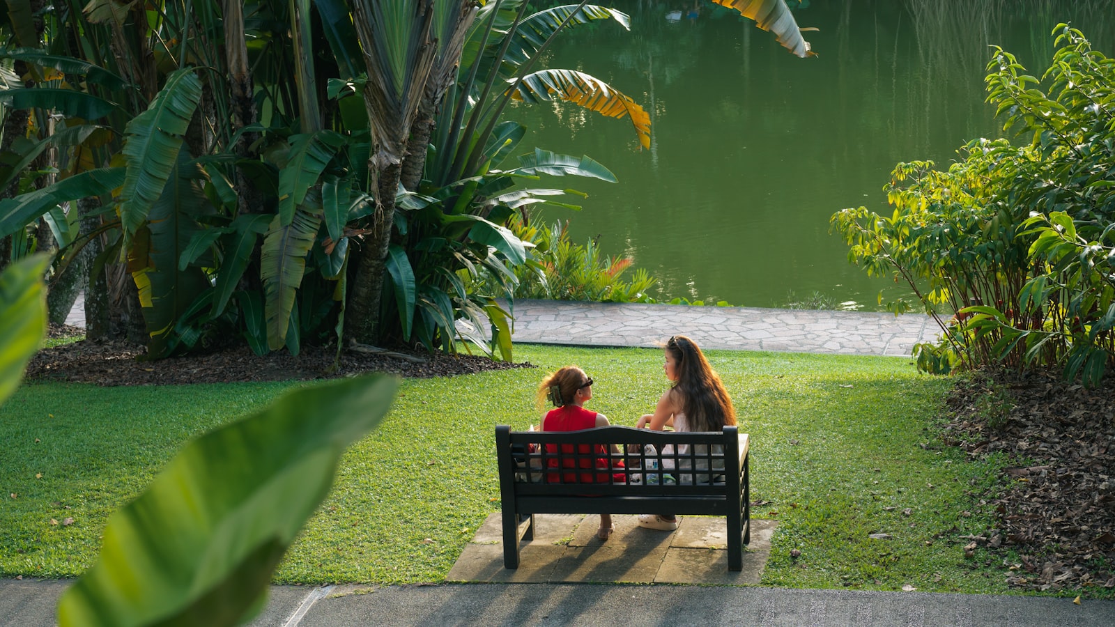 Parent walking with a young child in a Singapore park