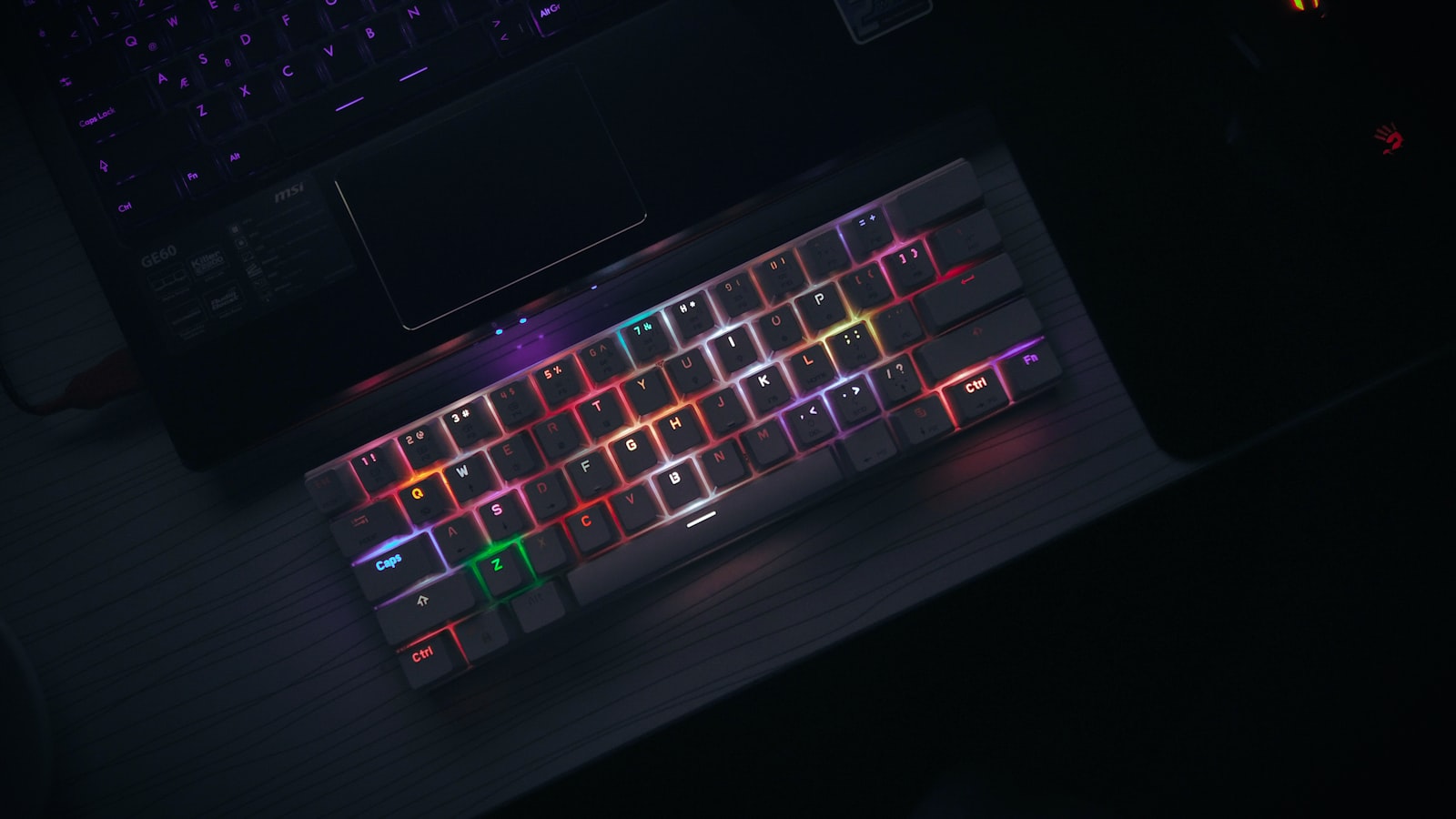 A laptop keyboard lit by low ambient light