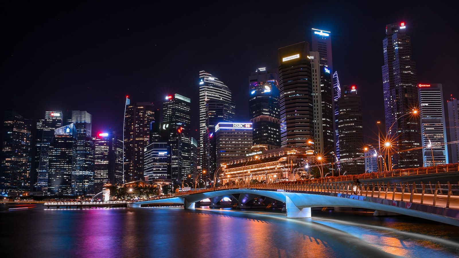 A quiet Singapore street at night viewed from across the road