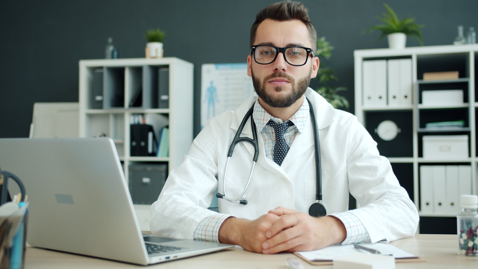 A stethoscope resting on a wooden desk