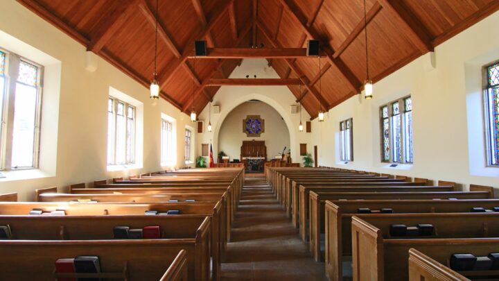 The interior of a church with empty pews