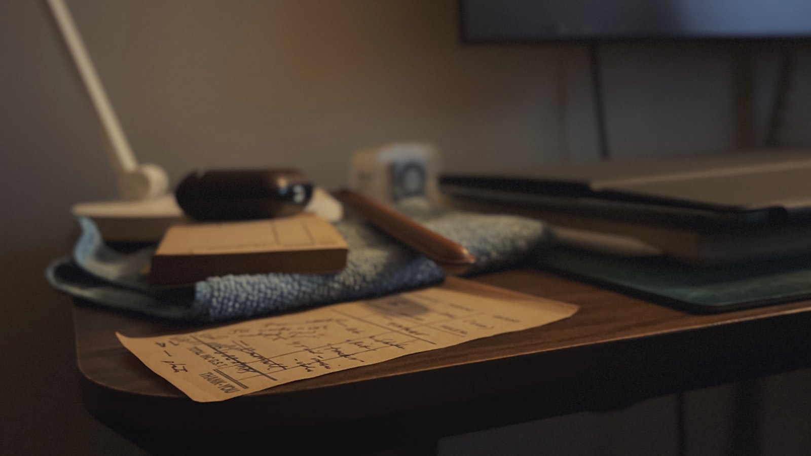 A closed folder resting on a plain desk