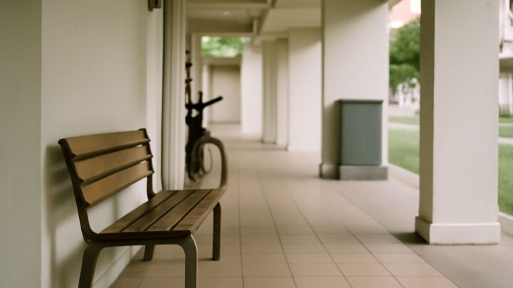 An empty covered walkway in a Singapore housing estate in morning light