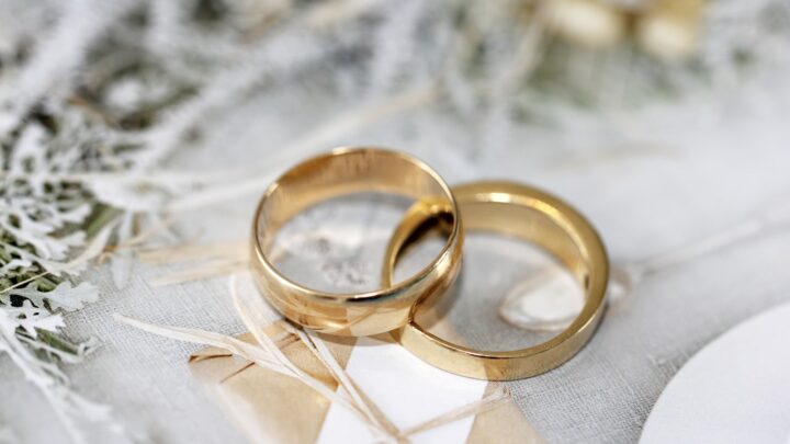 Two plain wedding bands resting on a light surface