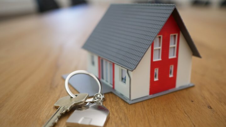 A set of keys resting on a wooden surface