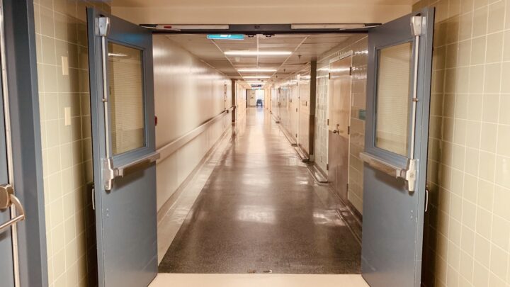 A quiet, brightly lit hospital corridor
