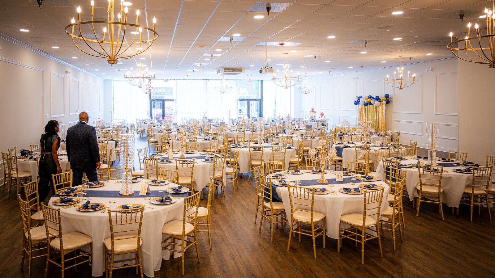 Rows of empty round banquet tables in a large function room